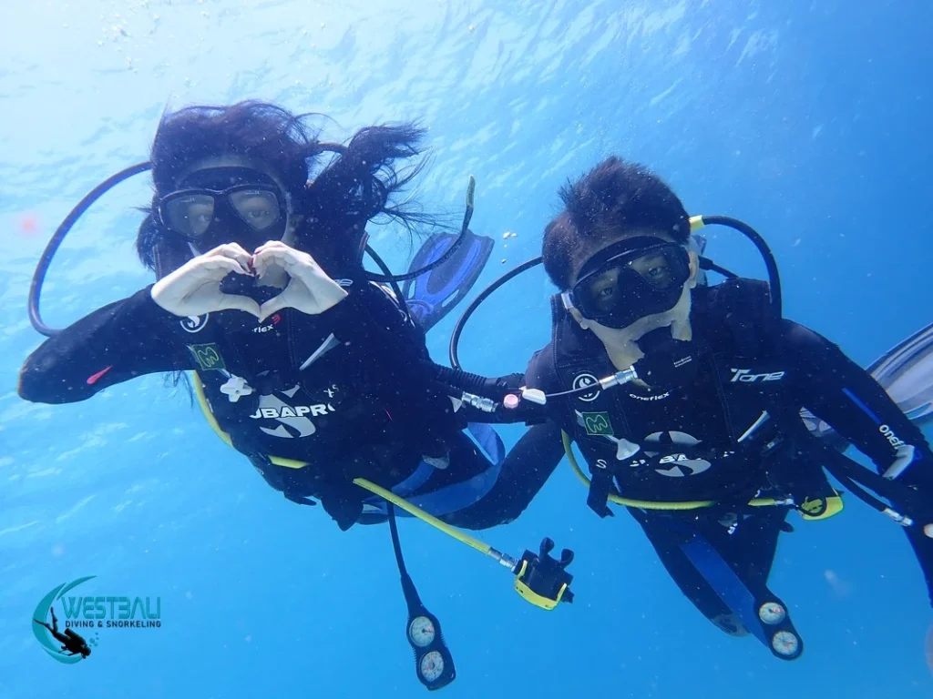 People try scuba diving at Menjangan Island, Bali.