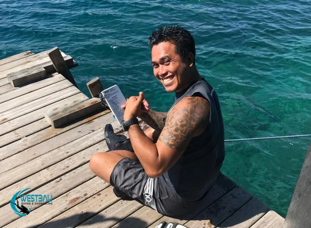 A PADI Instructor teaches a course on a jetty in Northwest Bali.