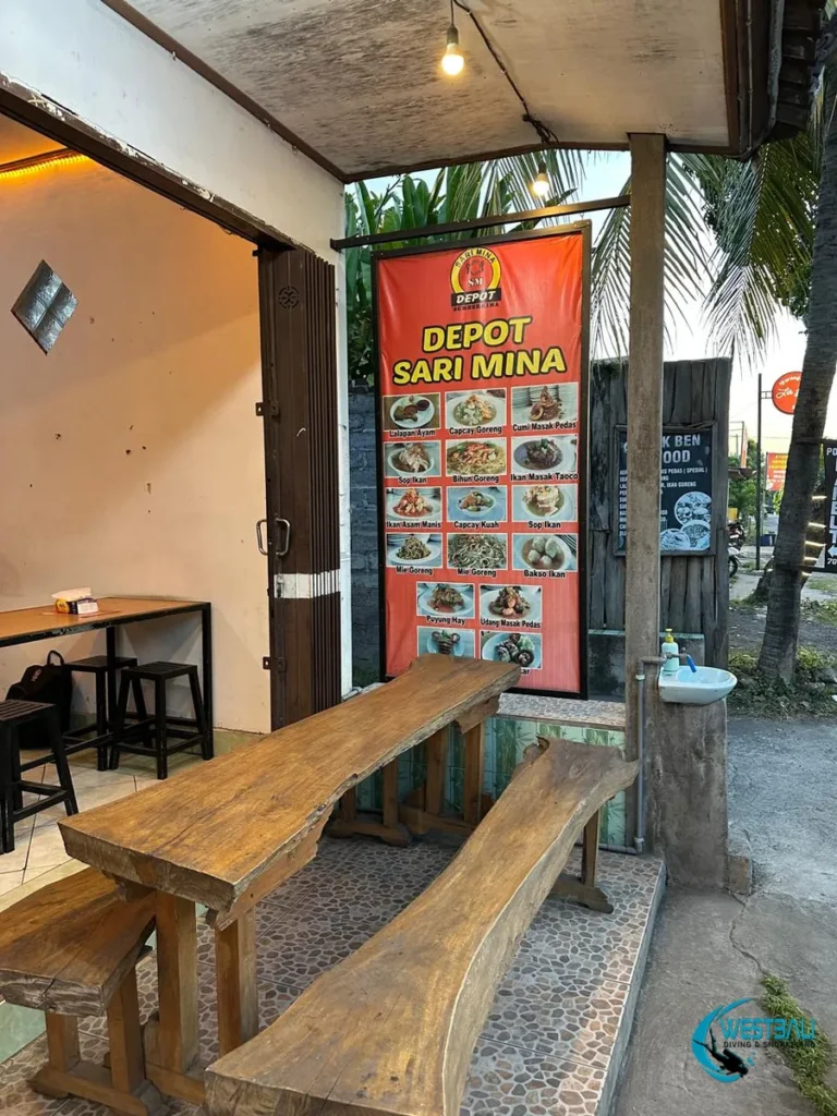 A photo menu and rustic wooden table with benches at Depot Sari Mina Sumberkima.