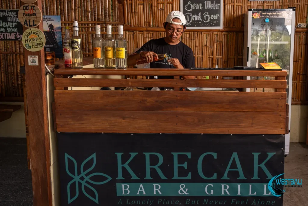 The owner of Krecak Bark & Grill prepares a drink at the bar.