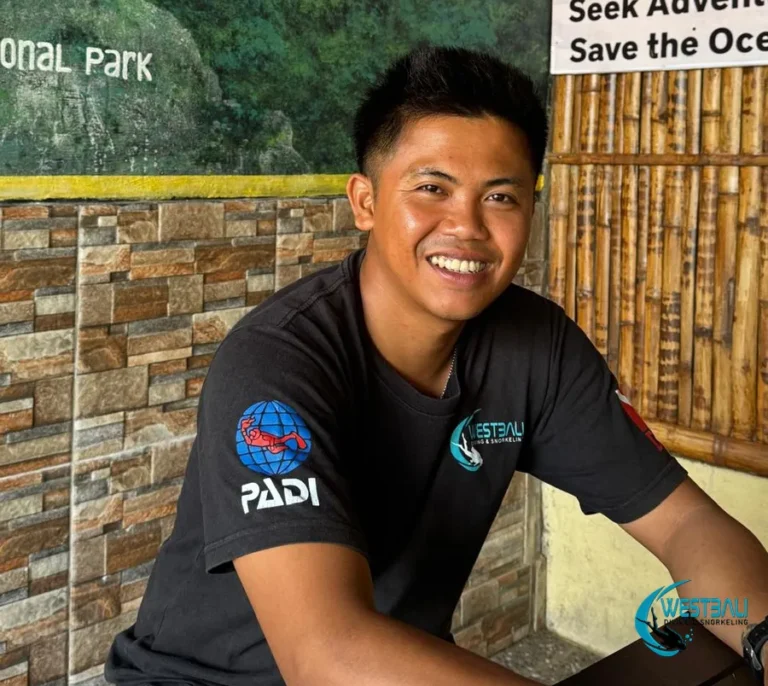 Eka, snorkeling guide at West Bali Diving & Snorkeling smiles at the office.